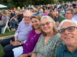 Friends waiting for a concert on a perfect summer evening